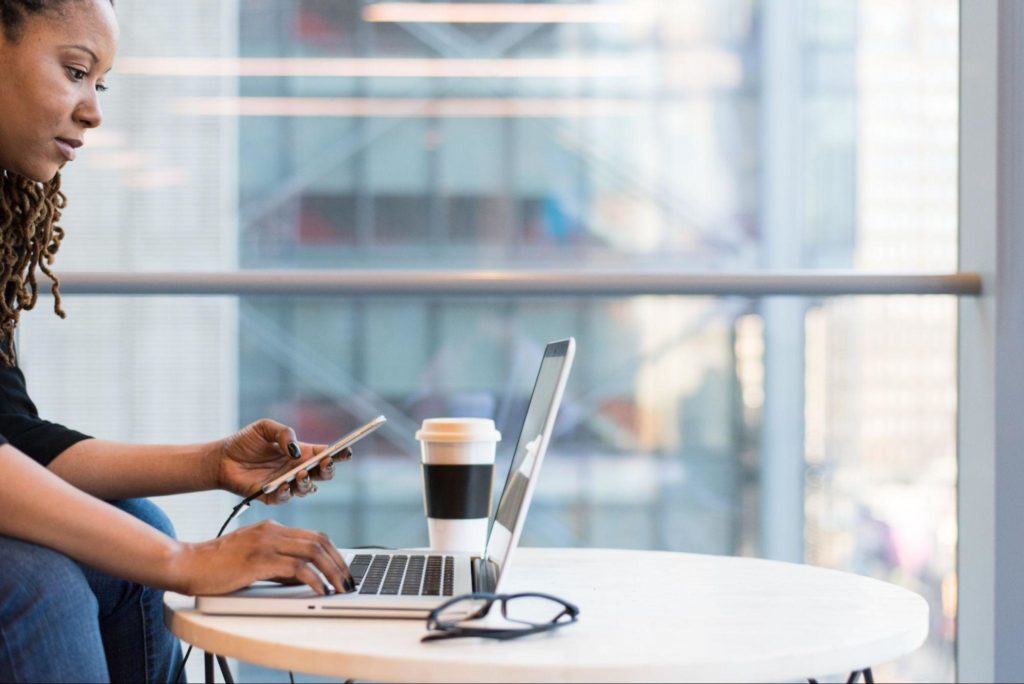 Woman creating a website on laptop