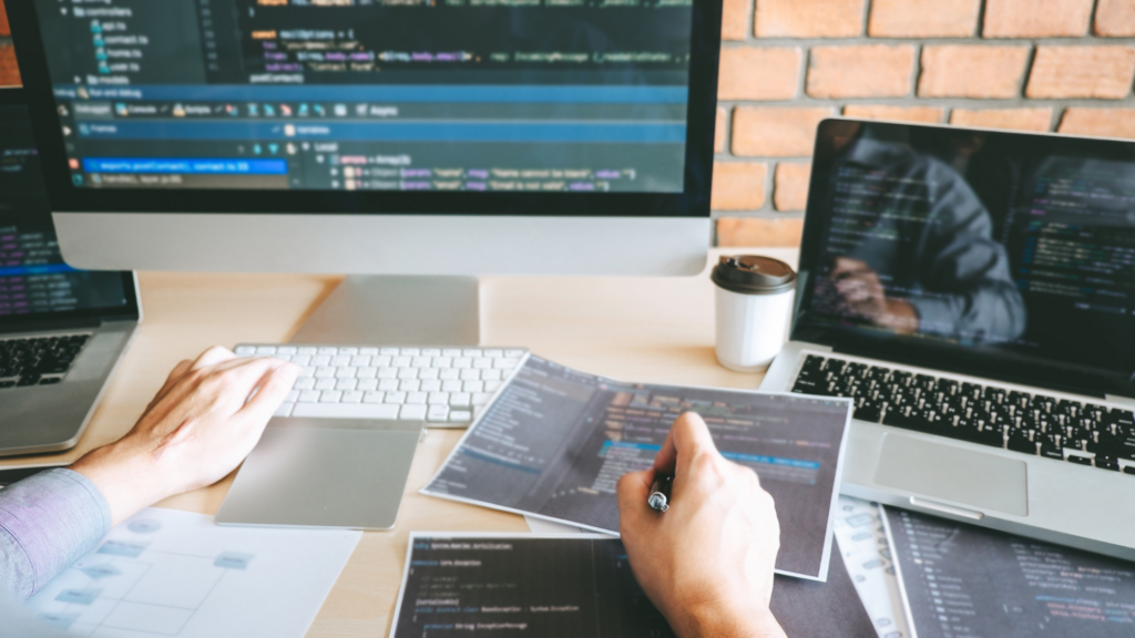 Why Small Businesses Need Custom Software 2 Person working on creating custom software